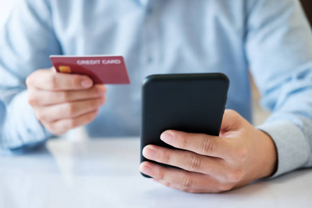 istock A man is using his phone to pay for a credit card 2142124383
