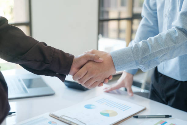 istock Businessmen shake hands after completing a business deal. 2142131820
