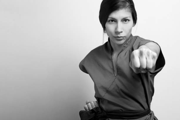 Young kung-fu woman B&W in studio