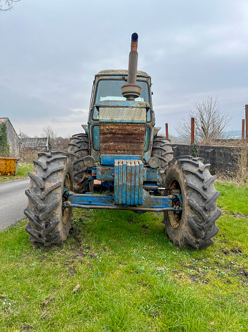Old vintage blue farm tractor
