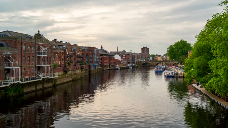 View of River Ouse and buildings along the river in York, North Yorkshire, England, 4k time-lapse