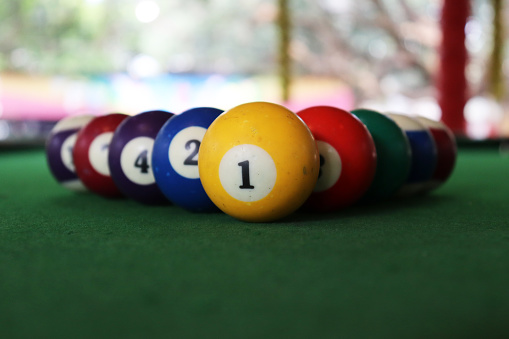 Creative photography of multi coloured billiard balls - closeup view.