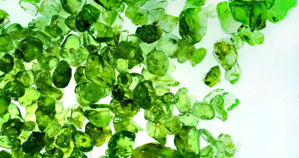 Raw green Peridot from Pakistan on black background. Weight 4.16 grams (20.8 carats). Photographed on black background.