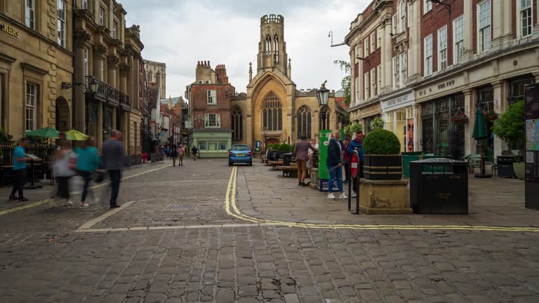 Crowds of people at Saint Helen’s Square in York city centre, North Yorkshire, England, 4k time-lapse (Zoom out)