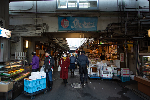 Tokyo,Japan- January 15 2018:  tourist visit the food street inside The Tsukiji Market. In June 2017, plans to move the fish market were restarted, but delayed to Autumn of 2018 in July