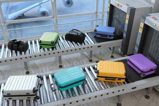 High Angle View Of Airport Security Checkpoint With X-Ray Scanner Scanning Luggages