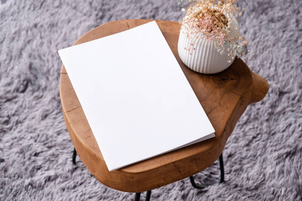 istock blank magazine mockup on coffee table with vase and grey rug 2142441868