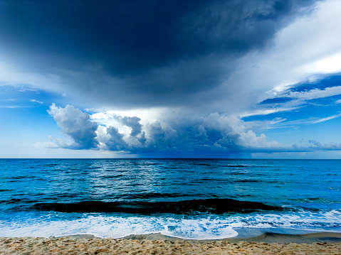 Dark clouds with wide angle calm dark blue ocean in Sarasota, Florida