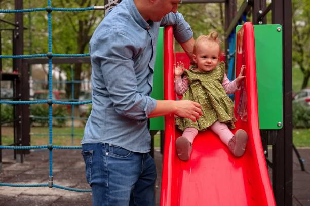 istock Father playing with baby girl 2142472674