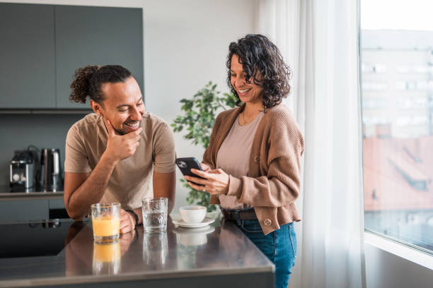 istock Hispanic Couple Enjoying Online Shopping Together 2142474318