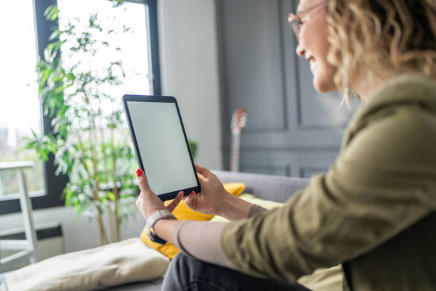 istock Woman using digital tablet at home 2142497195