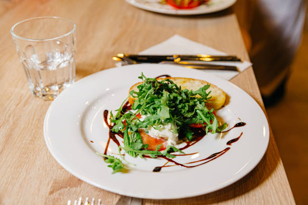 istock Arugula Salad on Toast with Balsamic Drizzle 2142542905