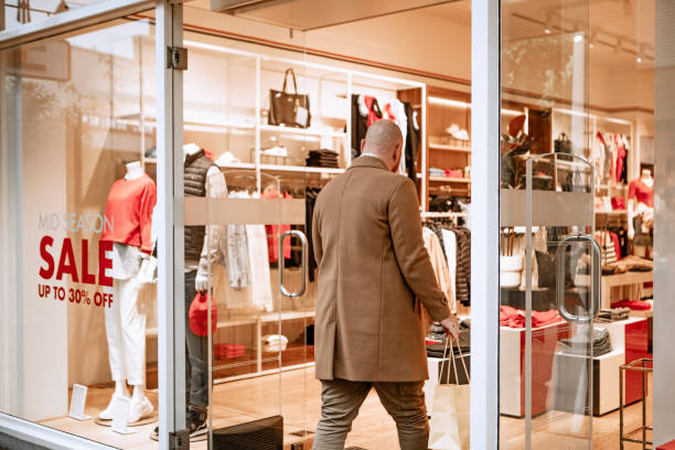 Handsome man shopping alone on a day trip