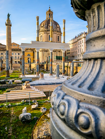 A beautiful late afternoon scene of Trajan's Forum, part of the Imperial Forums of Rome, in the historic heart of the Eternal City. In the background the baroque church of the Santissimo Nome di Maria al Foro and the Trajan Column, while in the foreground the remains of the majestic colonnade of the Basilica Ulpia, built in honor of the Emperor Trajan's family. The Roman Forum, one of the largest archaeological areas in the world, represented the political, legal, religious and economic center of the city of Rome, as well as the nerve center of the entire Roman civilization. In 1980 the historic center of Rome was declared a World Heritage Site by Unesco. Image in original 4:3 ratio and high definition quality.