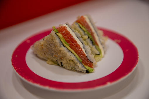 Salmon sushi sandwich served on a plate