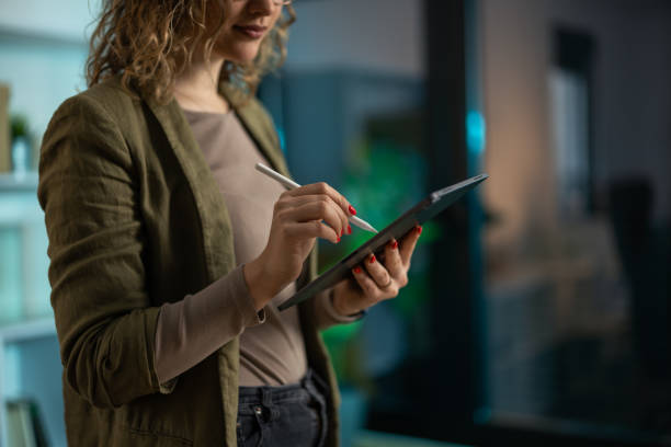 istock Young businesswoman using digital tablet in the office 2142617230