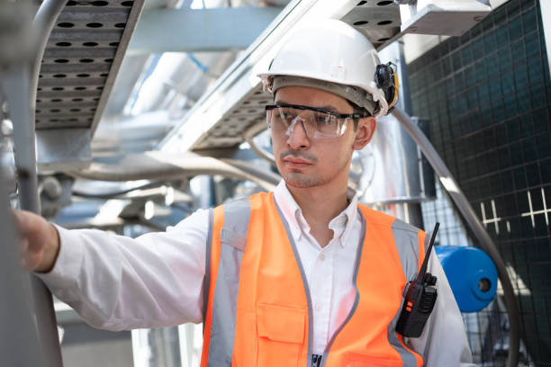 istock Engineers are inspecting a large building or industrial facility's cooling system for the air conditioning. 2142638130