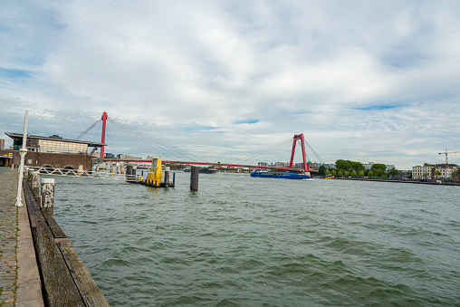 Skyline of Rotterdam from a boat with Williams Bridge. Willemsbrug