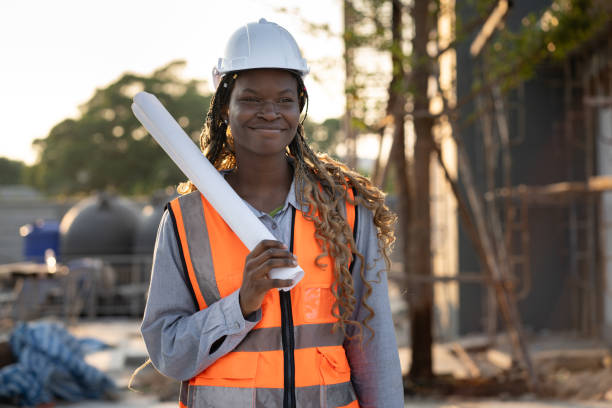 istock Portrait Worker engineer African woman working with paper work at construction site 2142646898