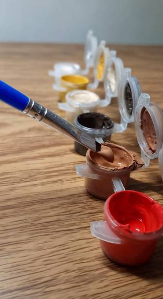 istock Paint brush on acrylic paint background. 2142663969