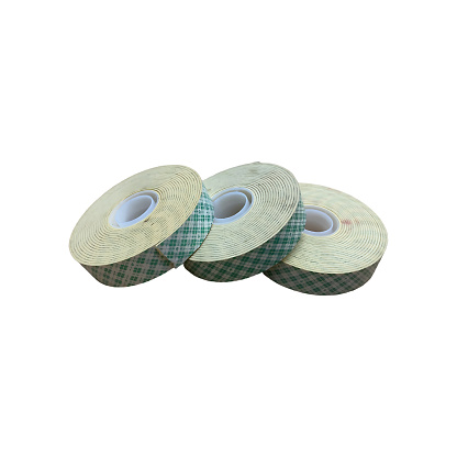 Roll of green and white double-sided tape