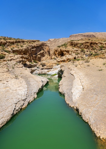 Wadi Bani Khalid, Oman, March 18, 2024: View of the river in the locality of Wadi Bani Khalid on a sunny day.