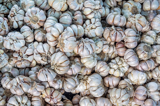 Fresh garlic at a greengrocers marked stall at a central marked place close to Bukit Lawang in the northern part of Sumatra
