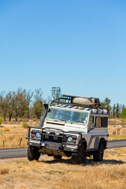 Namaqualand, South Africa - March 9, 2024: Old Land Rover Defender parked beside a national highway