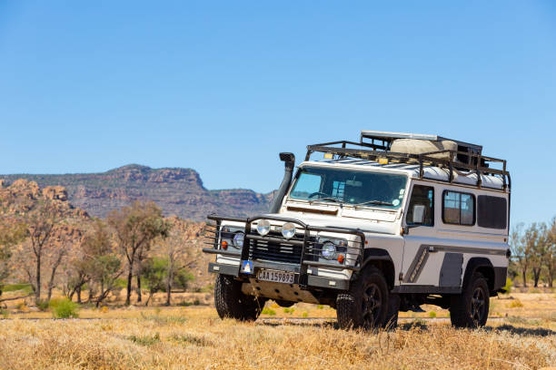 Namaqualand, South Africa - March 9, 2024: Old Land Rover Defender parked beside a national highway