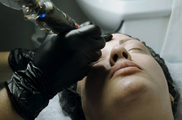 istock Correction with permanent make-up of woman's eyebrows. 2142854278