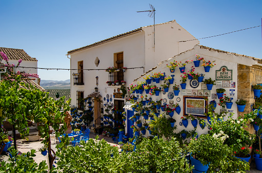 Patio de las Comedias adornado con macetas de colores. pueblo Andaluz, Iznajar, Cordoba. Verano.  Iznajar, July 17, 2023.