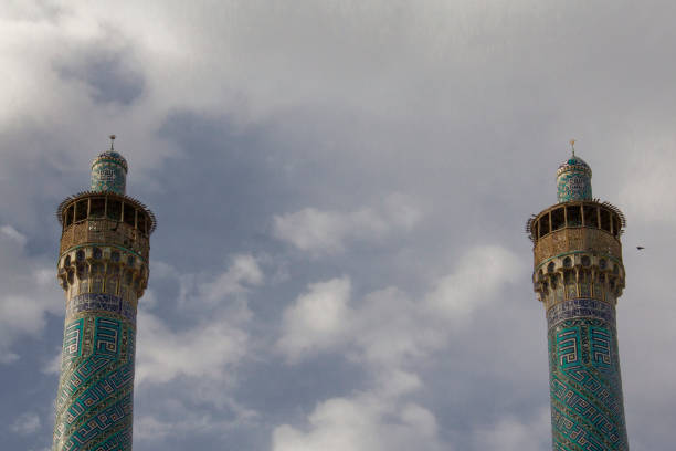 Damascus, Syria: the interior of the Sayyidah Ruqayya Mosque is renowned for its exquisite decoration, which blends Islamic artistry with a deeply spiritual atmosphere. The walls and ceilings are adorned with intricate mirror mosaics, creating a dazzling effect as light reflects off their surfaces. Delicate arabesque patterns and Quranic inscriptions, meticulously crafted in gold and turquoise hues, enhance the sacred ambiance.