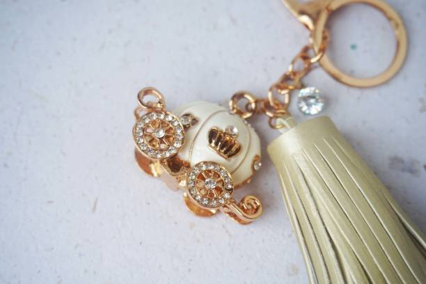 istock Key chain / bag charm on greyish white background. Top view. 2142950050