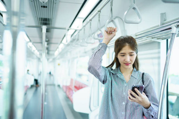 istock Businesswoman using smartphone while traveling on a train. 2142969206