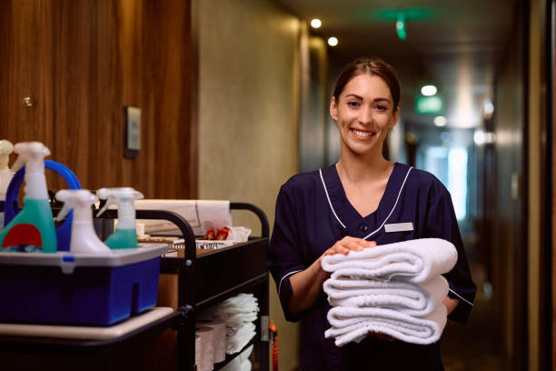 istock Young happy maid working in a hotel and looking at camera. 2143008478
