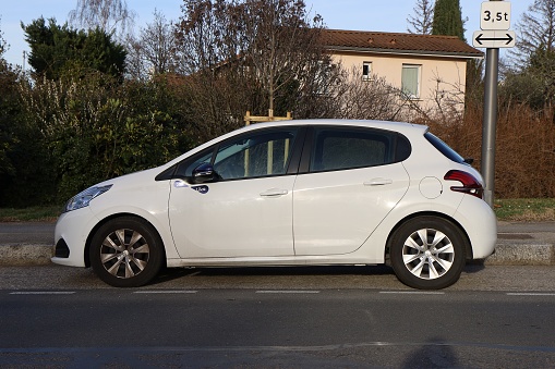 White Peugeot 208 car, town of Caluire et Cuire, department of Rhône, France