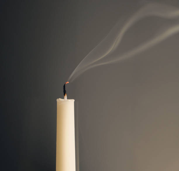 istock Burned out candle with a smoke 2143053908