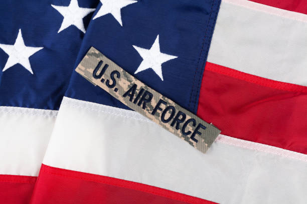 US AIR FORCE branch tape on USA national flag US AIR FORCE branch tape on USA national flag background combat infantry badge stock pictures, royalty-free photos & images