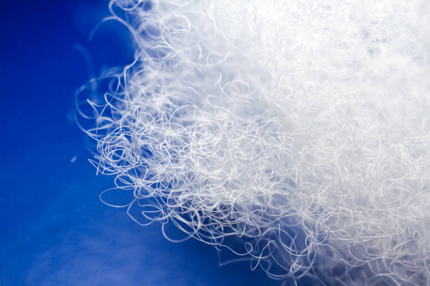 istock Extreme macro of polyester stable fiber on blue background 2143069050