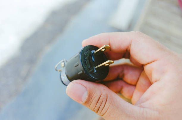 istock black male plug close up 2143078411