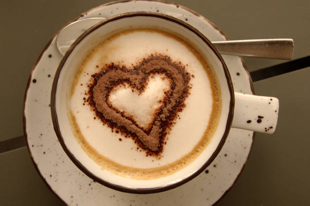 Breakfast coffee served in a Sankt Gallen café with chocolate sprinkles in the shape of a styllised heart