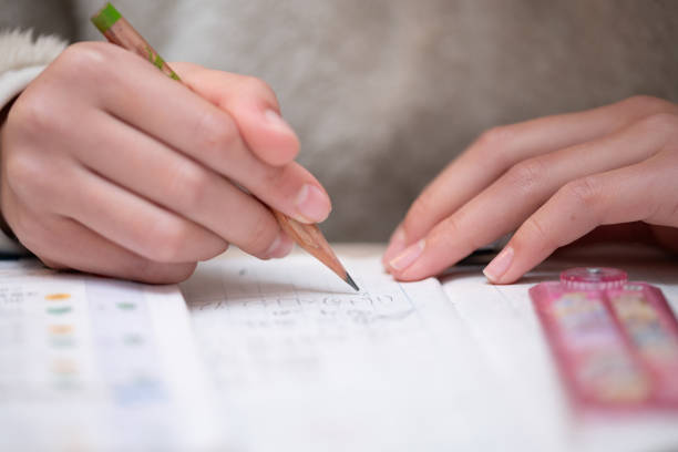 istock Hands of a child studying 2143112724