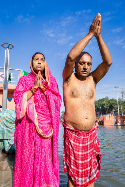 istock devotee couple praying after bathing in holy river water at morning from flat angle 2143148617
