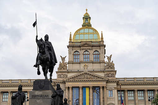 Close-up of the Prague Museum of History building with the statue
