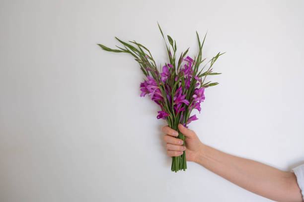 Girl holding a bouquet of wildflowers.