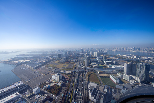 View from helicopter flying over Tokyo, approaching Tokyo Bay Bridge