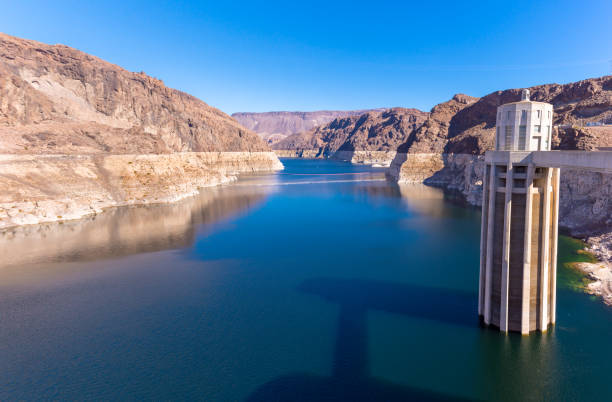 Hoover Dam intake tower and Lake Mead in full sun with deep blue sky