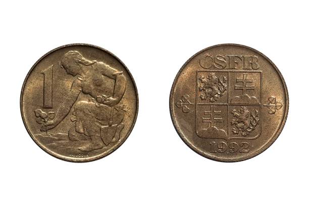 istock 1 Koruna 1992 on white background. Coin of  		Czechoslovakia. Obverse CSFR state shield between linden leaves, date and signature below. Reverse 2143275537