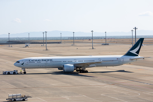 Tokoname, Japan - March 18, 2024 : Cathay Pacific Boeing 777-300ER at the Chubu Centrair International Airport in Tokoname City, Aichi Prefecture, Japan.