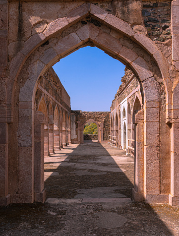 The symmetry of arches in a monument in Mandu, Madhya Pradesh, India